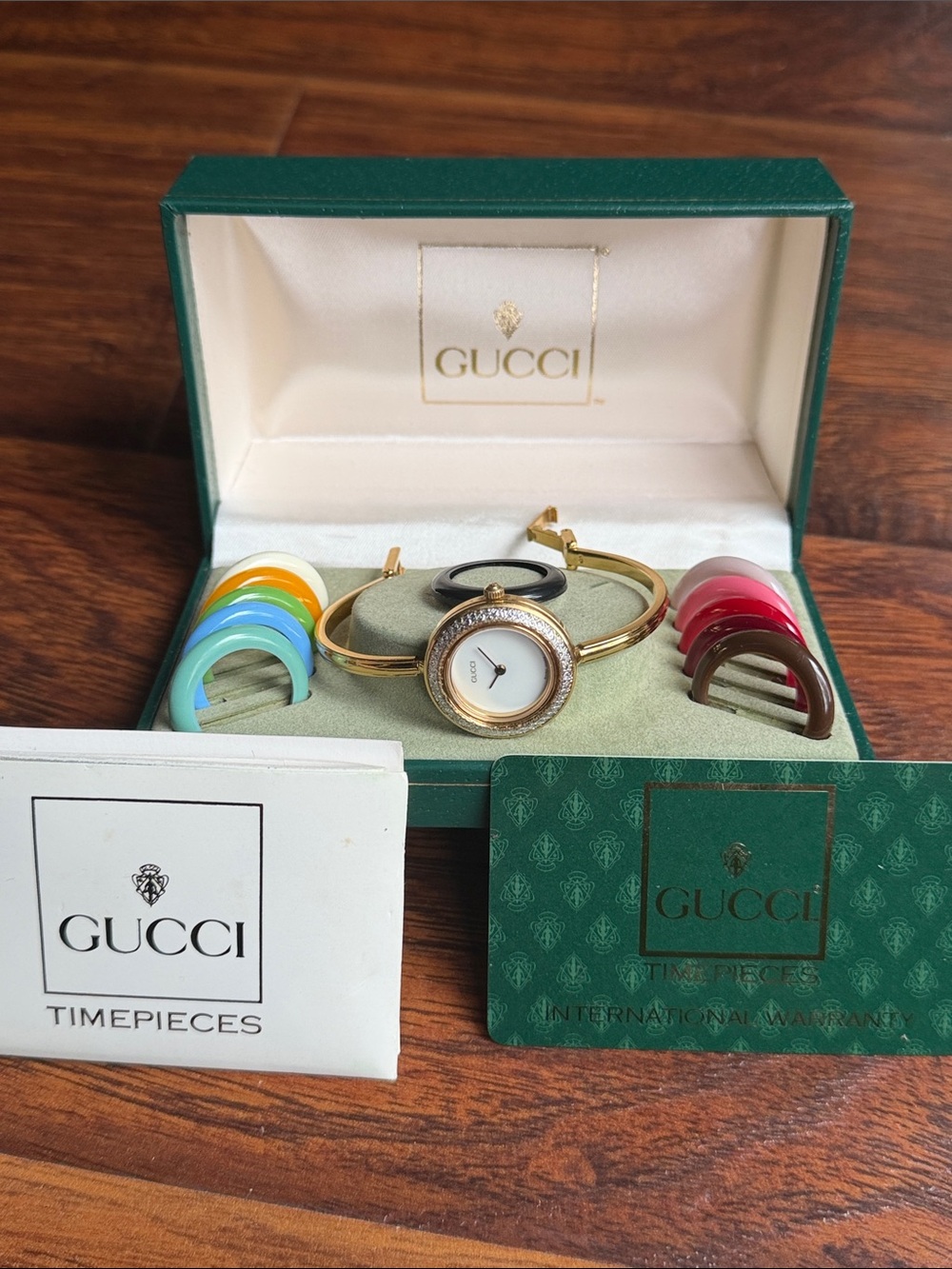 Gucci Gold Bangle Watch with Interchangeable Colored Bezels